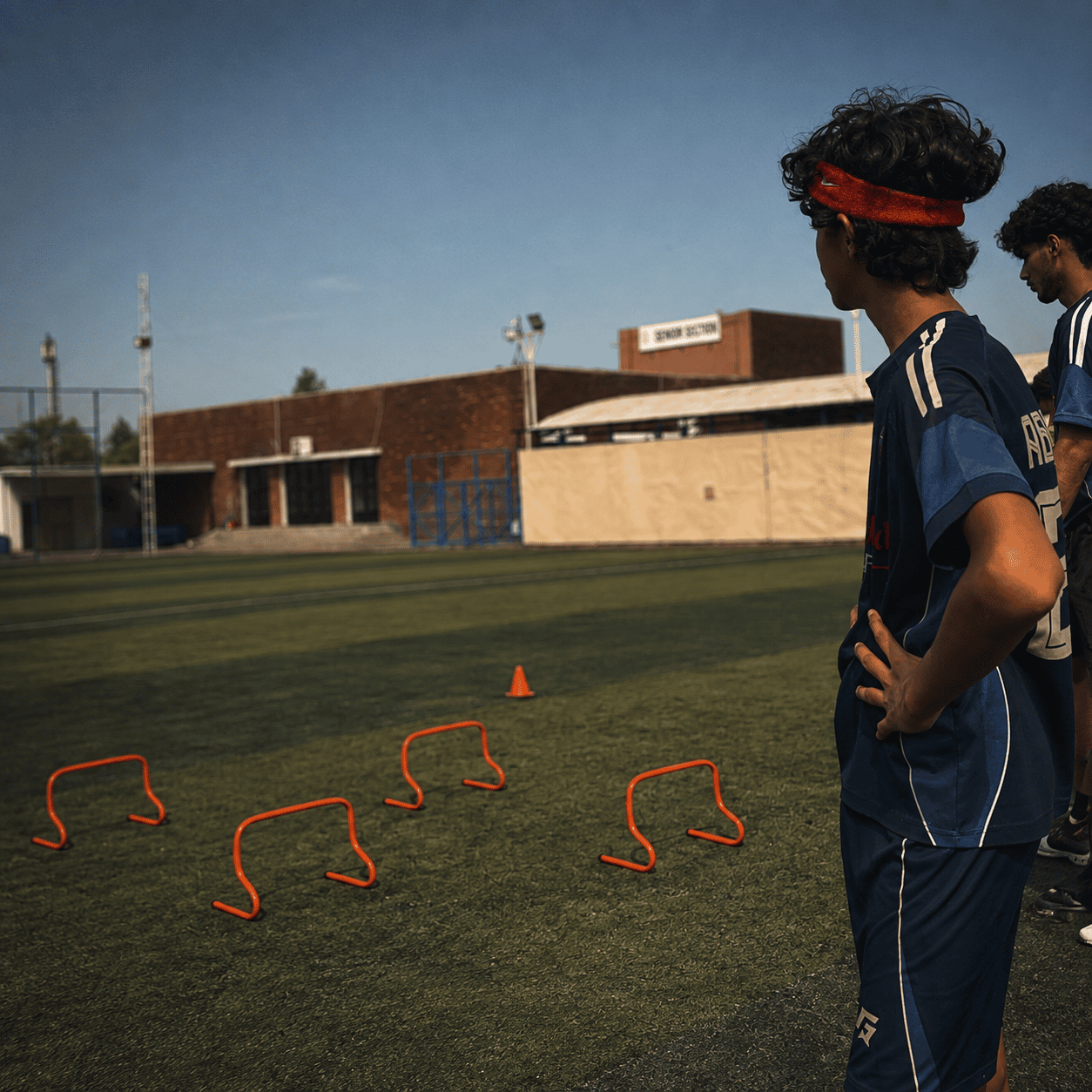 TWA FC players working through a line of low hurdles in training
