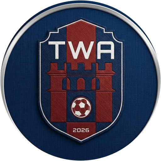 The TWA FC club crest — a castle on a shield, ringed in silver