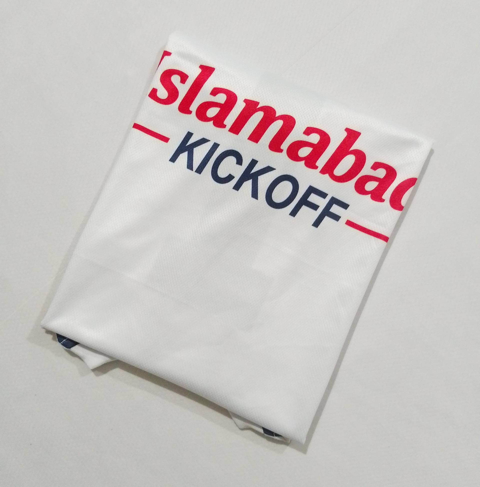 The back of the white away shirt, folded, showing the chest sponsor