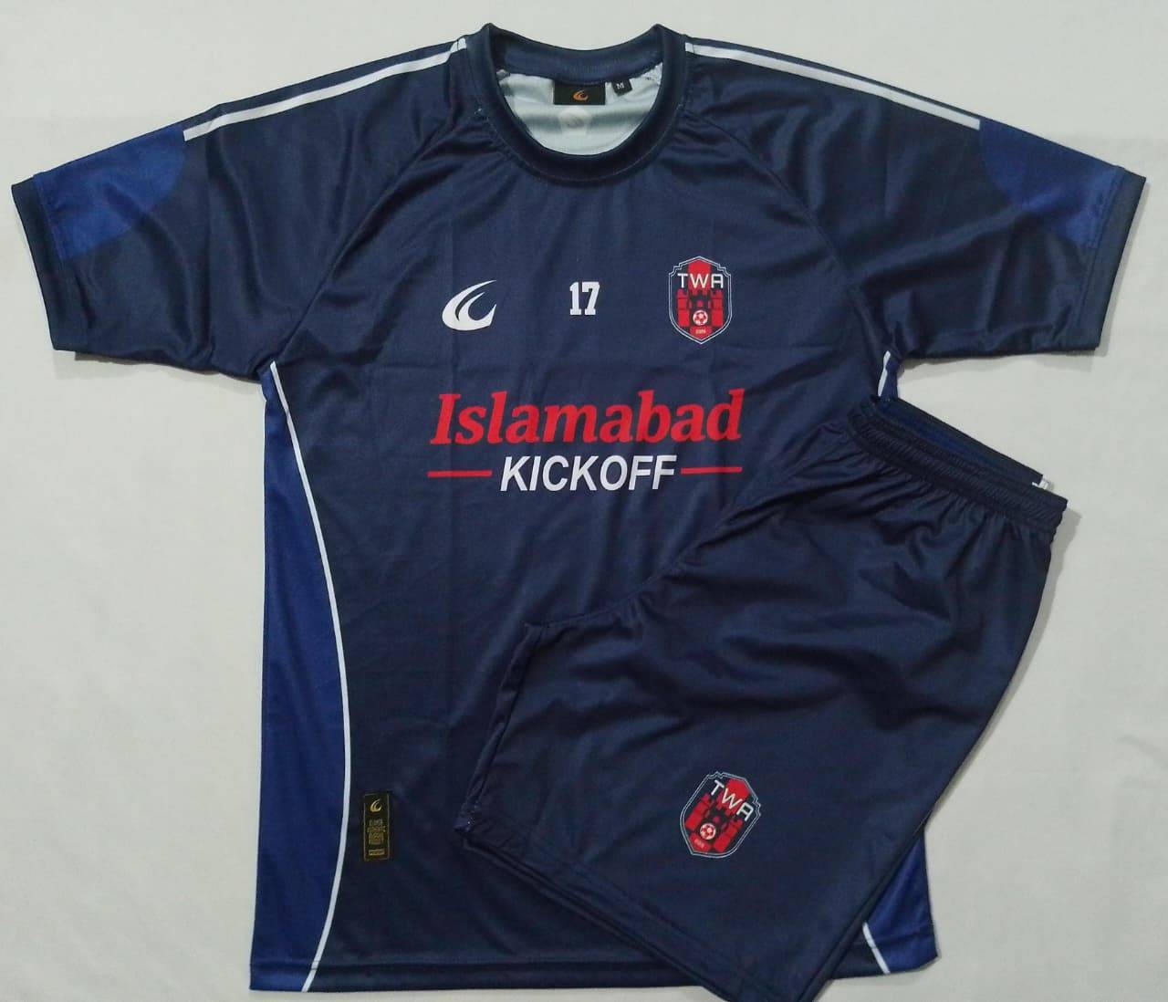 The navy home shirt and shorts laid out flat together