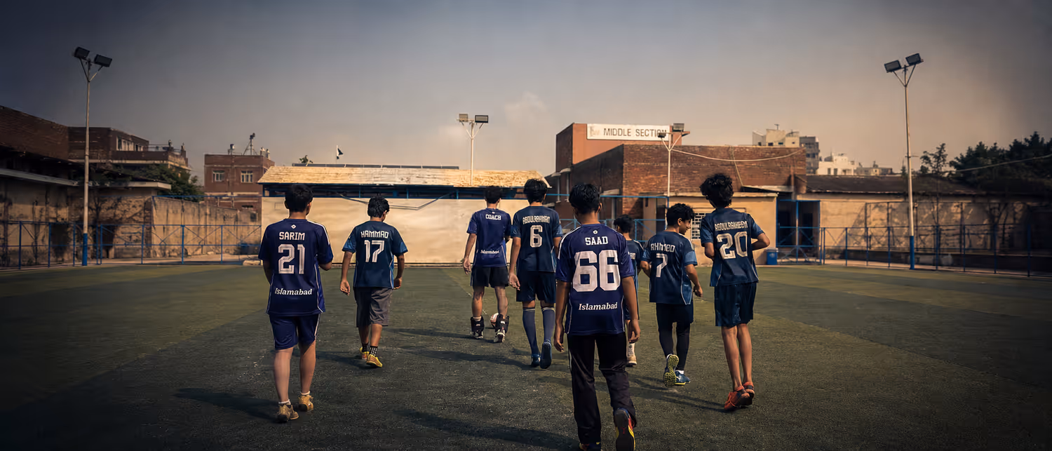 The TWA FC squad walking out onto the pitch together before a session