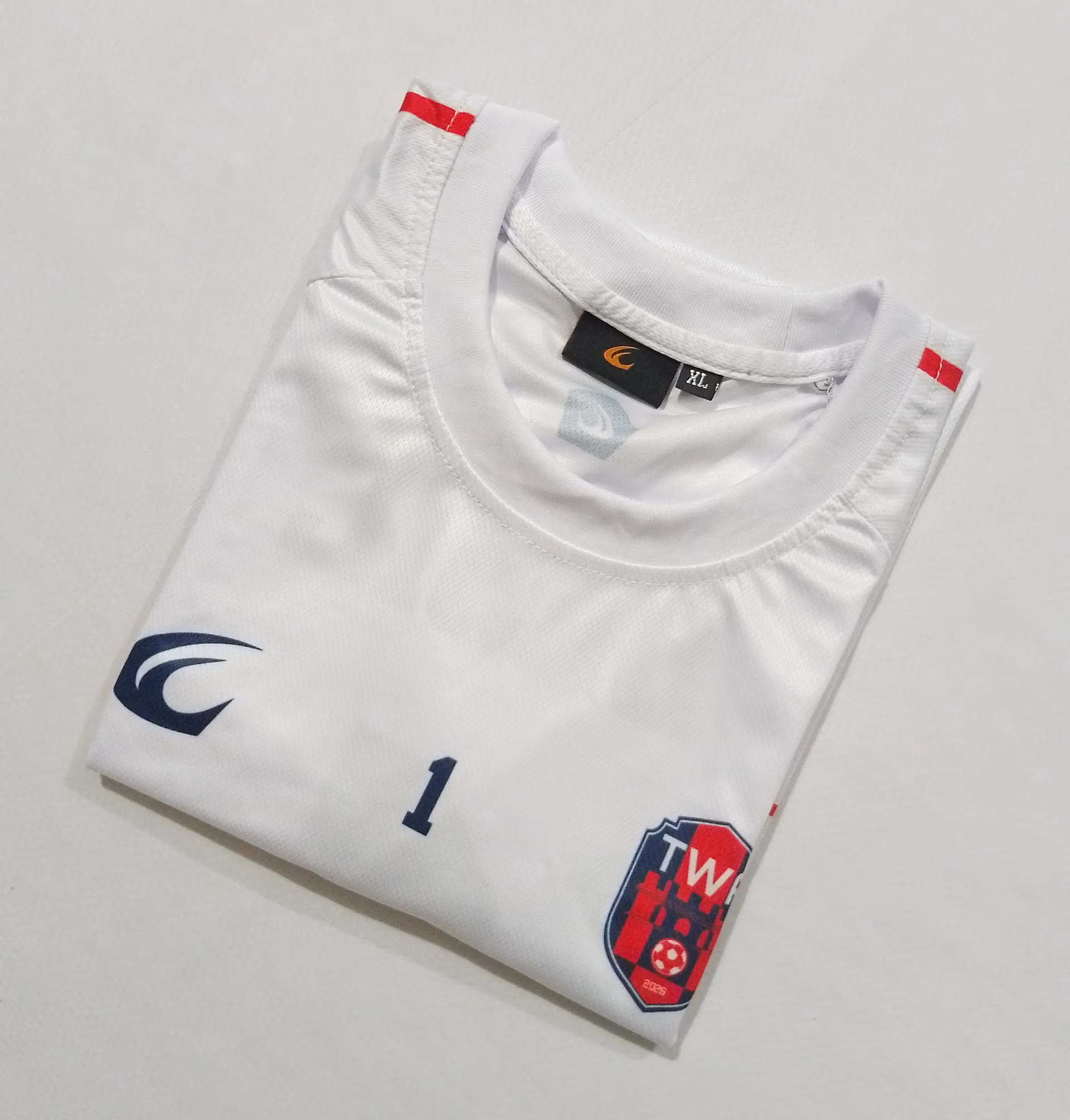 Close-up of the collar and the embroidered TWA crest on the white shirt