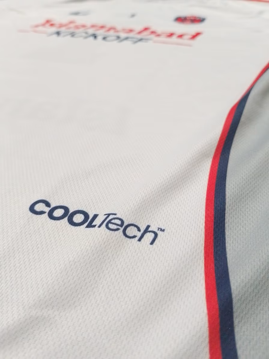 Macro shot of the CoolTech mesh panel on the white away shirt