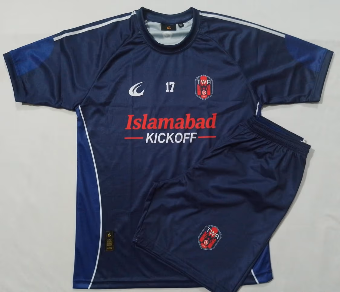 The navy home shirt and shorts laid out flat together